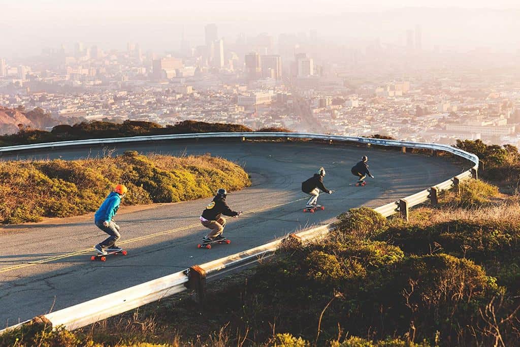 group of skaters at a curve road