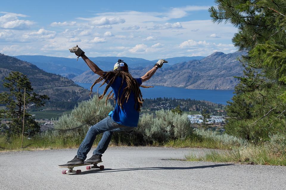 man playing skateboarding with a beautiful view