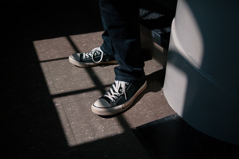person wearing converse shoes